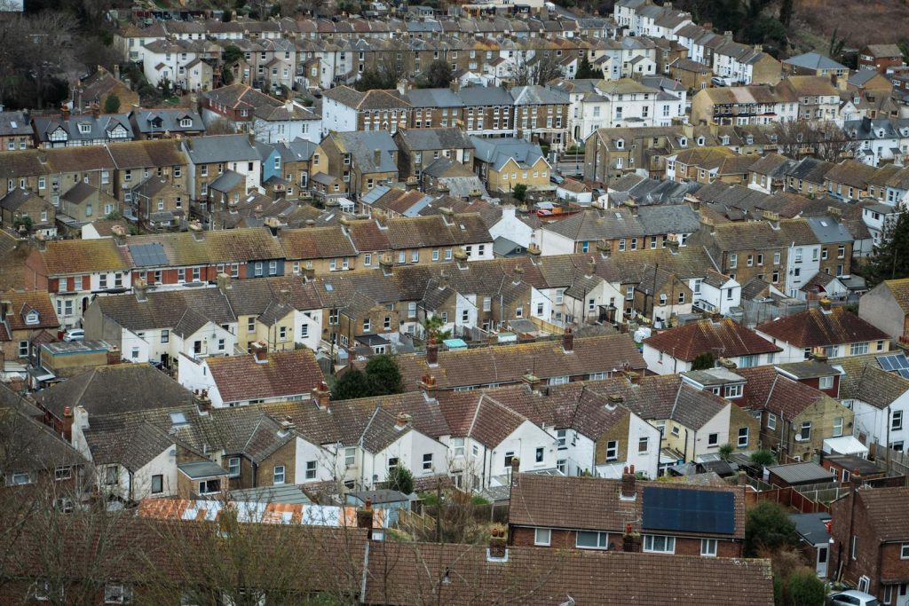 Aerial shot of a densely packed historic UK town showcasing traditional architecture and community living.